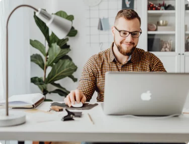 Man adding images to marketing email.